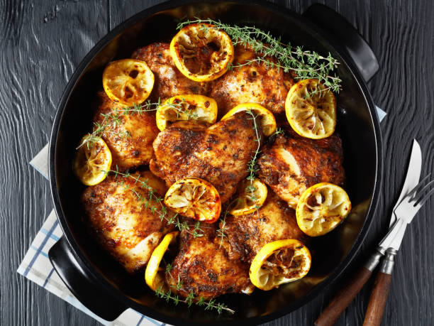 Braised Chicken Thighs in a ceramic pan stock photo