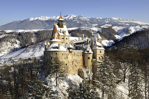 Bran (Dracula's) Castle from Transylvania, Romania Bran Castle in winter with snow and Bucegi mountains.More pictures with Dracula's Bran Castle in my portfolio ! romania stock pictures, royalty-free photos & images