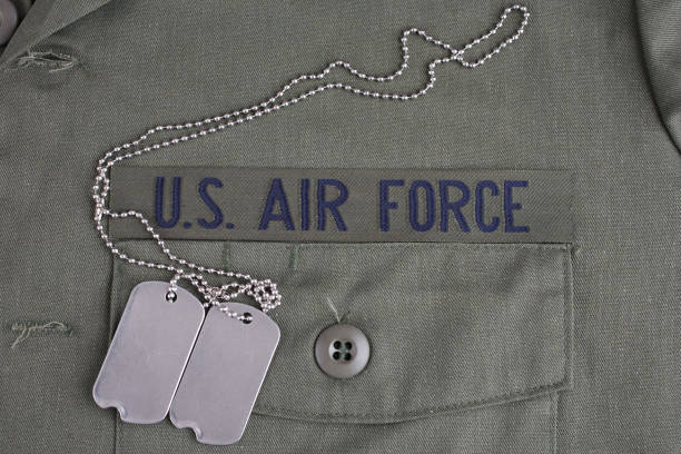 U.S. AIR FORCE Branch Tape with dog tags on olive green uniform U.S. AIR FORCE Branch Tape with dog tags on olive green uniform background us air force stock pictures, royalty-free photos & images