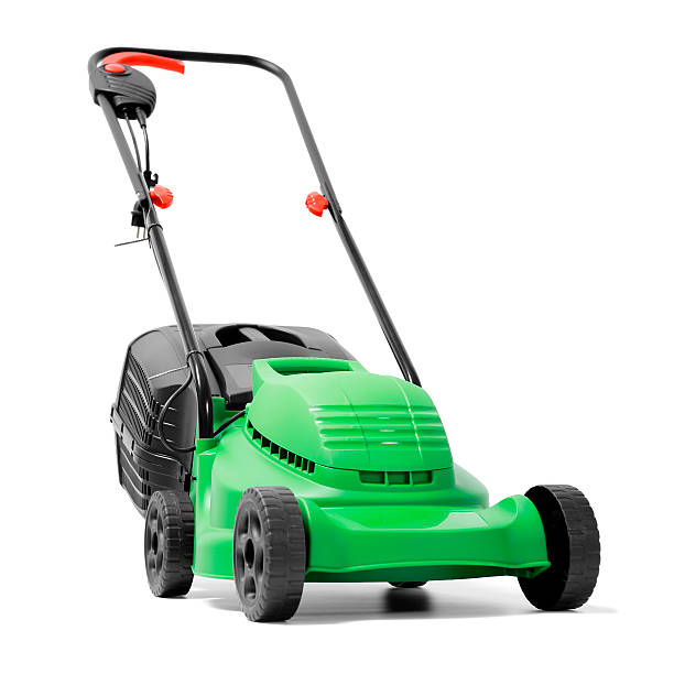 A brand new green electric power lawn mower Electric Lawn Mower isolated on white. gardening equipment photos stock pictures, royalty-free photos & images