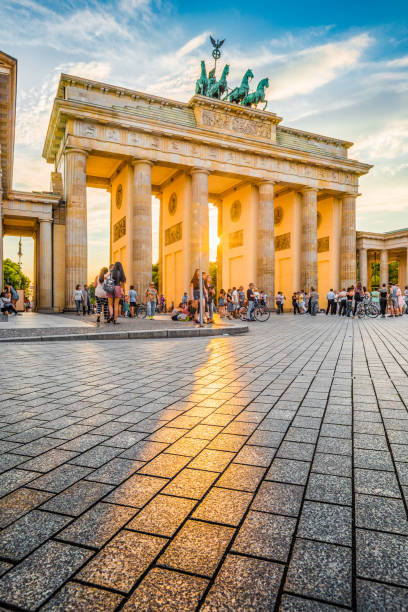 Brandenburg Gate at sunset, Berlin, Germany Famous Brandenburger Tor, one of the best-known landmarks and national symbols of Germany, in beautiful golden evening light at sunset, Berlin, Germany outcrop stock pictures, royalty-free photos & images