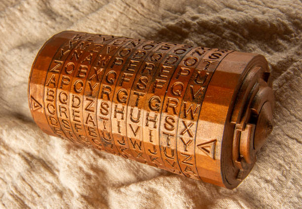 Brass cryptex invented by Leonardo da Vinci from the book da vinci code. Cryptographic equipment printed on a 3D printer. Word creativity as password set by letters rings. stock photo