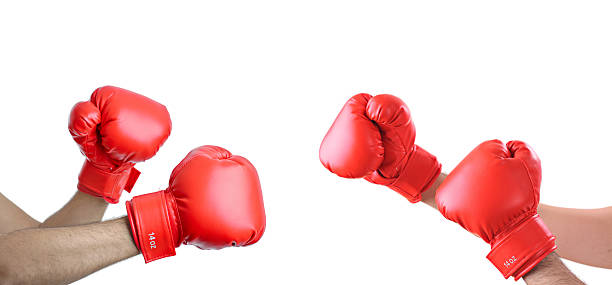 Brawl A view of hands with boxing gloves A view of hands with boxing gloves isolated on white boxing gloves stock pictures, royalty-free photos & images