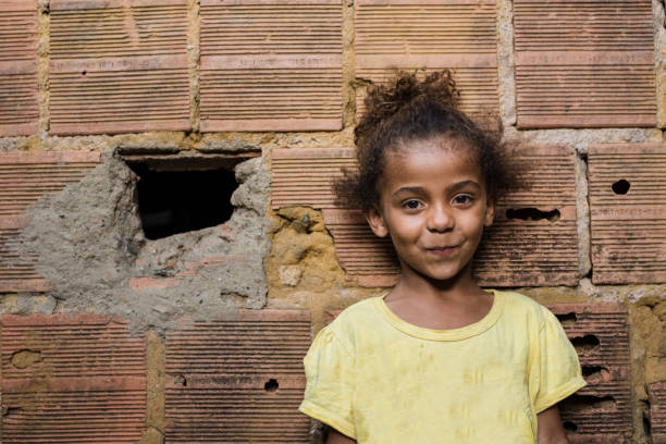 Brazilian little girl on a brick wall Brazilian little girl at home (Rio de Janeiro State). south american culture stock pictures, royalty-free photos & images