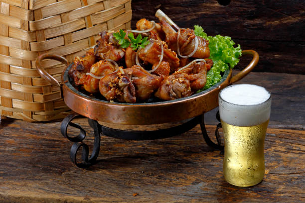 Brazilian style fried chicken with cold beer Brazilian style fried chicken with cold beer chicken bird stock pictures, royalty-free photos & images