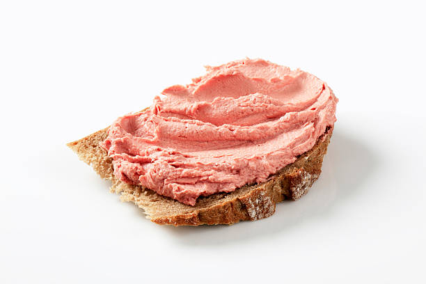 Bread with meat mousse Slice of bread with smooth liver pate liver pâté photos stock pictures, royalty-free photos & images