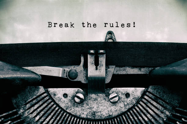 Break the rules inspirational quotes Break the rules words typed on a vintage typewriter in black and white. rule breaker stock pictures, royalty-free photos & images