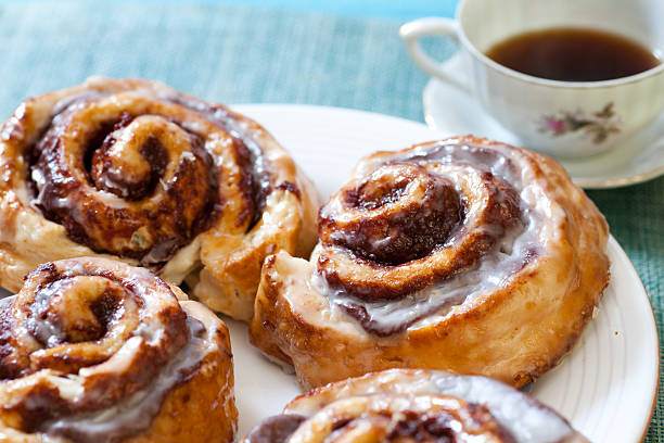 Breakfast Cinnamon buns and coffee sticky stock pictures, royalty-free photos & images