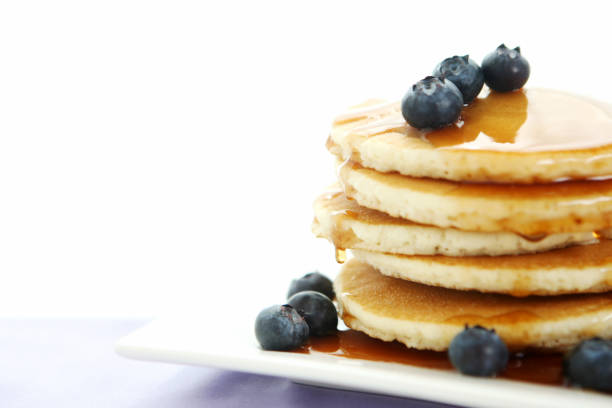 breakfast table with pancakes stock photo