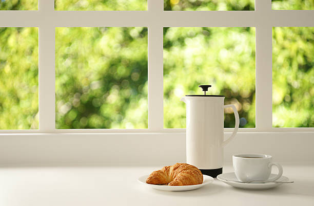 Breakfast Window Spring Croissant and coffee by the window. french food photos stock pictures, royalty-free photos & images