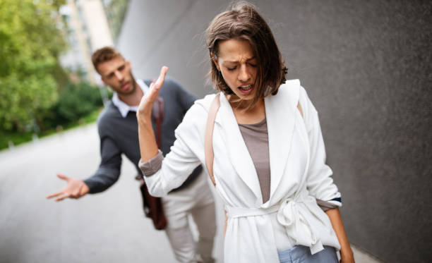 Breakup of couple with man and sad girlfriend outdoor. Divorce, couple, love, pain concept. stock photo