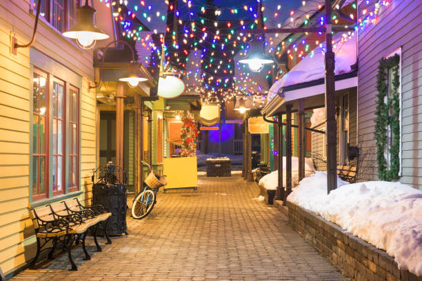 Breckenridge, Colorado, USA downtown streets Breckenridge, Colorado, USA downtown streets at night in the winter with holiday lighting. village photos stock pictures, royalty-free photos & images