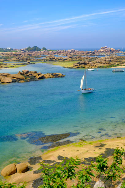 Breton traditional sailing boat at Saint Guirec at the pink granite coast in Brittany, France Port of Saint Guirec at the pink granite coast in Brittany, France during a beautiful summer day. brittany france stock pictures, royalty-free photos & images