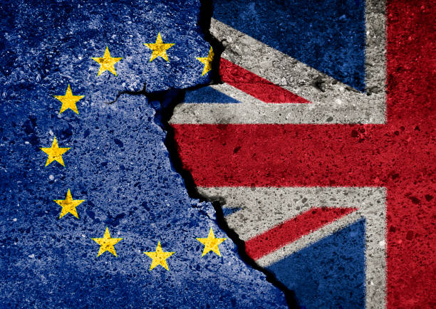 Brexit symbol. Concept illustration.  EU and UK flag on broken wall. stock photo