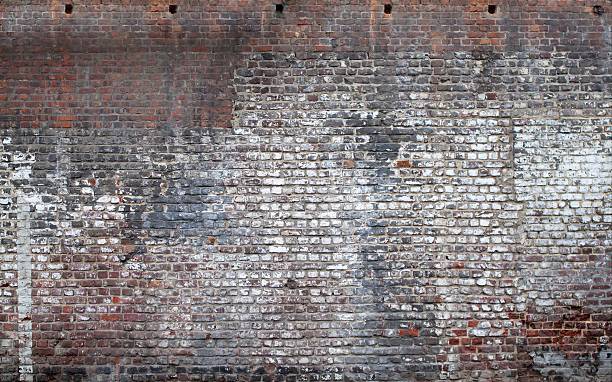 Brick Exterior wall from a very old building stock photo