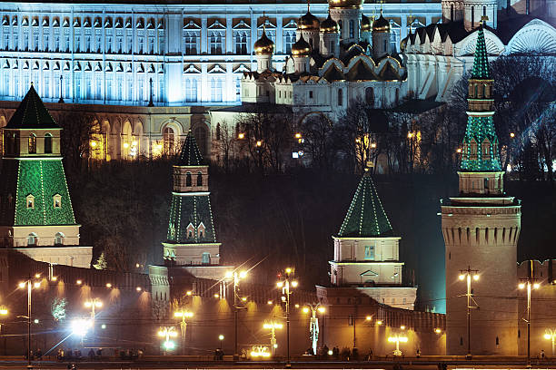 Brick wall and towers of the Moscow Kremlin at night stock photo