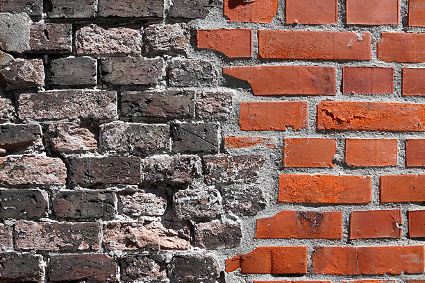 Brick Wall Old/ New Half new and half old brick wall. old vs new stock pictures, royalty-free photos & images