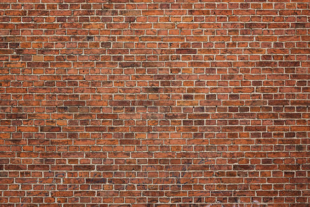 Brick wall Grunge red brick wall background with copy space brick stock pictures, royalty-free photos & images