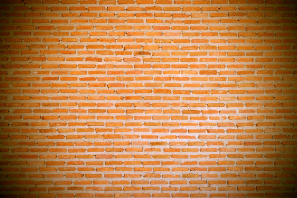 brick wall texture background with dark vignette stock photo