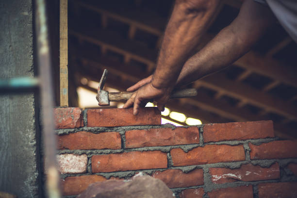 Bricklayer builds a new house,mason at work Bricklayer builds a new house,mason at work bricklayer stock pictures, royalty-free photos & images