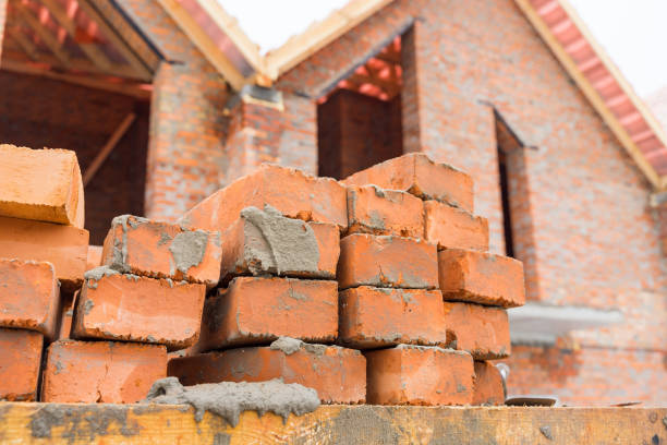 Bricks on the background of a building under construction. stock photo