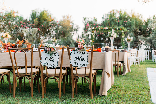 Wedding reception chairs for wedding couple with bride and groom wording