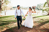 Wedding bride and groom celebrating with joy in nature