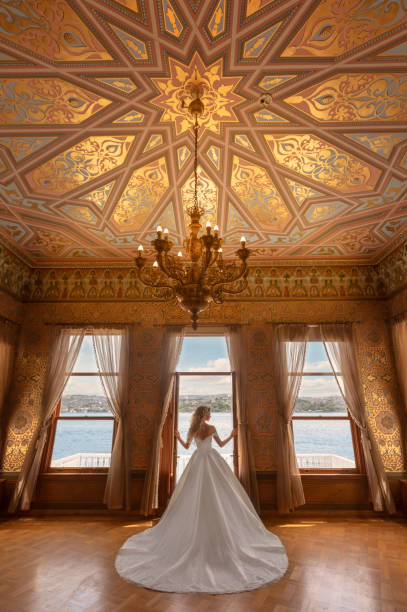 Bride History Palace Leaving - Wedding in the Seascape Luxury Hotel Bride, Rear View, Wedding Dress, Palace, Leaving Garissone Innocent stock pictures, royalty-free photos & images
