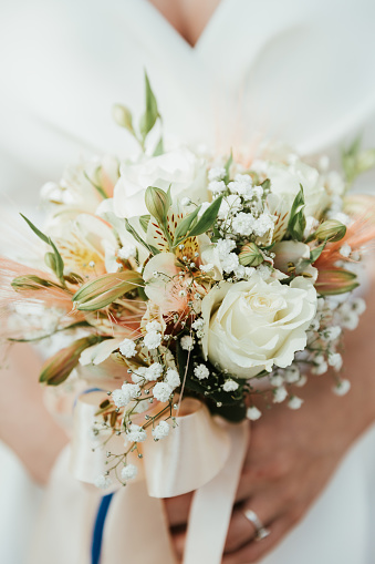 Close up of a bride holding her wedding bouquet