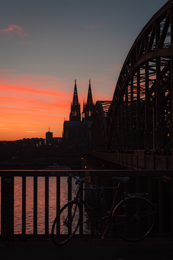 Cologne Cathedral and Hohenzollern Bridge with copy space in the dark night sky
