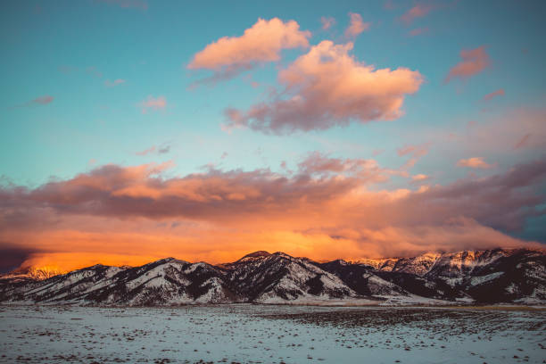 Bridger Glow Pano A wide view of the Bridger Mountains glowing orange at sunset. montana western usa stock pictures, royalty-free photos & images