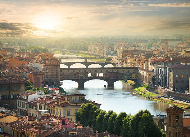 Bridges of Florence View on the bridges of Florence at sunrise arno river stock pictures, royalty-free photos & images