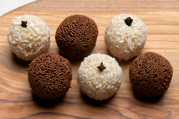 Brigadeiro, and beijinho, traditional Brazilian sweet delights. Brazilian delicious chocolate candies. white chocolate stock pictures, royalty-free photos & images