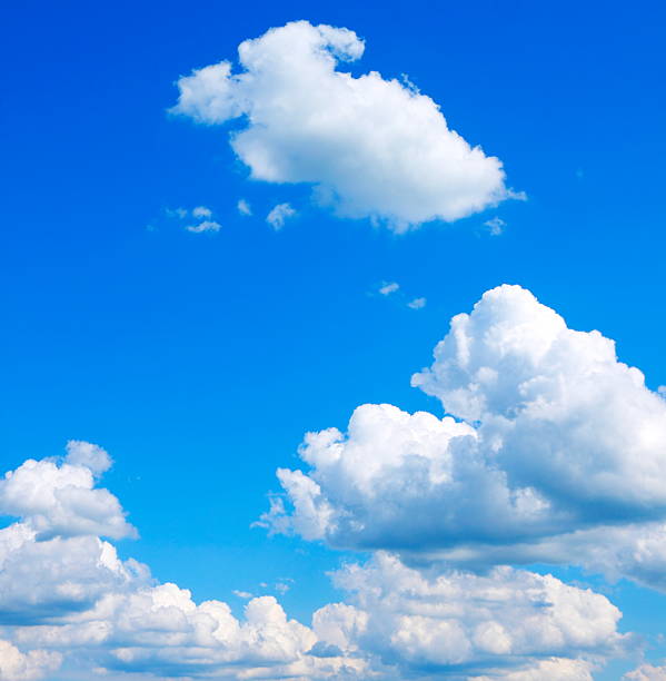Bright blue sky with puffy clouds "Real"Spring clouds and blue sky. cumulus cloud stock pictures, royalty-free photos & images