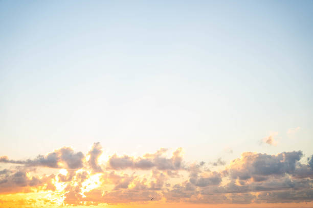 Bright cheery sunrise with clouds and open sky stock photo