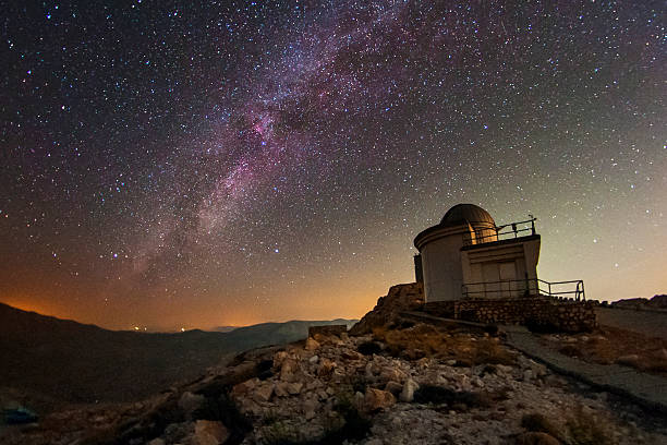 Bright Milky Way sky with Observatory in the distance Milky way as seen from an observatory in Turkiye. observatory stock pictures, royalty-free photos & images