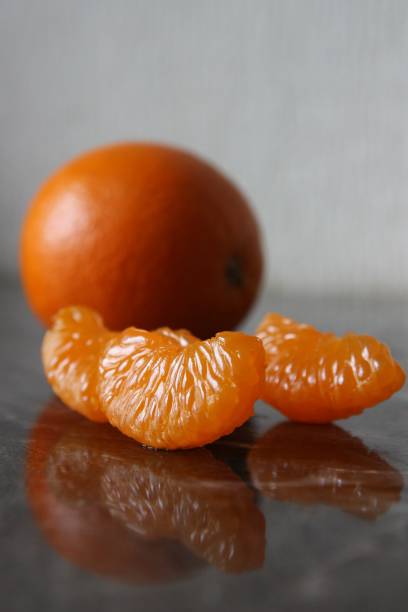 bright orange juicy Mandarin slices stock photo