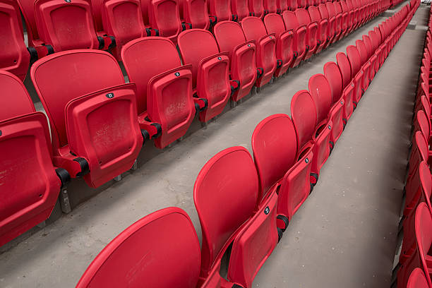 Bright red stadium seat stock photo