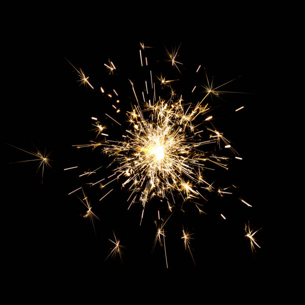 Bright sparks against black background stock photo