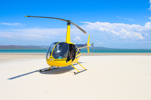 Chopper landing on the beach