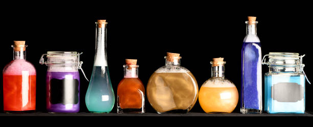 Brightly Colored Potions, Bubbling and Swirling in Glass Bottles stock photo
