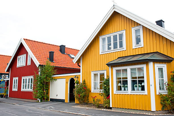 brightly painted houses in scandinavia - villa sverige bildbanksfoton och bilder