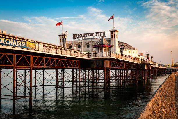 Brighton Pier at sunset in Sussex, England, UK Brighton, UK - August 25, 2016: Brighton Pier at sunset in Sussex, England, UK brighton stock pictures, royalty-free photos & images