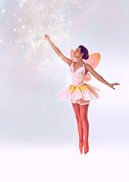 Bringing the magic A full length shot of a cute fairy casting a spell fairy stock pictures, royalty-free photos & images