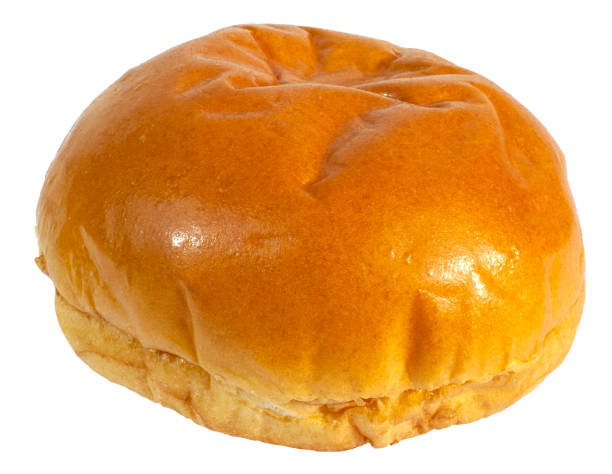 brioche bun Freshly baked brioche bun isolated on white. bun bread stock pictures, royalty-free photos & images