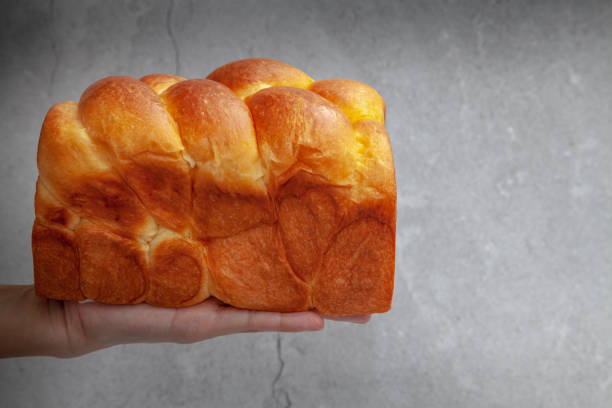 Brioche is a bread of French origin that is similar to a highly enriched pastry, and whose high egg and butter content gives it a rich and tender crumb stock photo