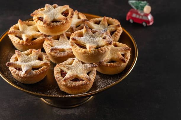 British Christmas mince pies on dark background. stock photo