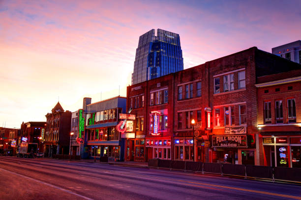 Broadway in downtown Nashville, Tennessee Broadway in downtown Nashville, Tennessee. Lower Broadway is a renowned entertainment district for country music. Nashville is the capital of the U.S. state of Tennessee. Nashville is known as the country-music capital of the world. The city is also known for its culture and commerce and great bar scene. broadway nashville stock pictures, royalty-free photos & images