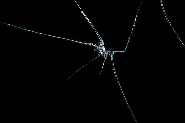 Broken glass Broken glass, isolated on black background cracked stock pictures, royalty-free photos & images
