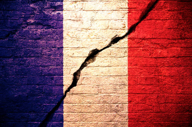A broken wall with the flag of France stock photo